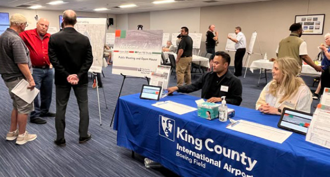 A photo of a community outreach event at King County International Airport.