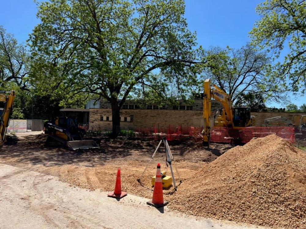 Work In Progress: Site work for a new water line and reduction of impervious paving.