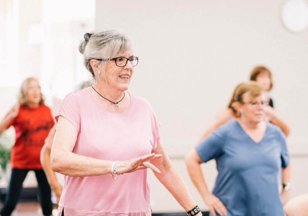 Older adults exercising in a group fitness class