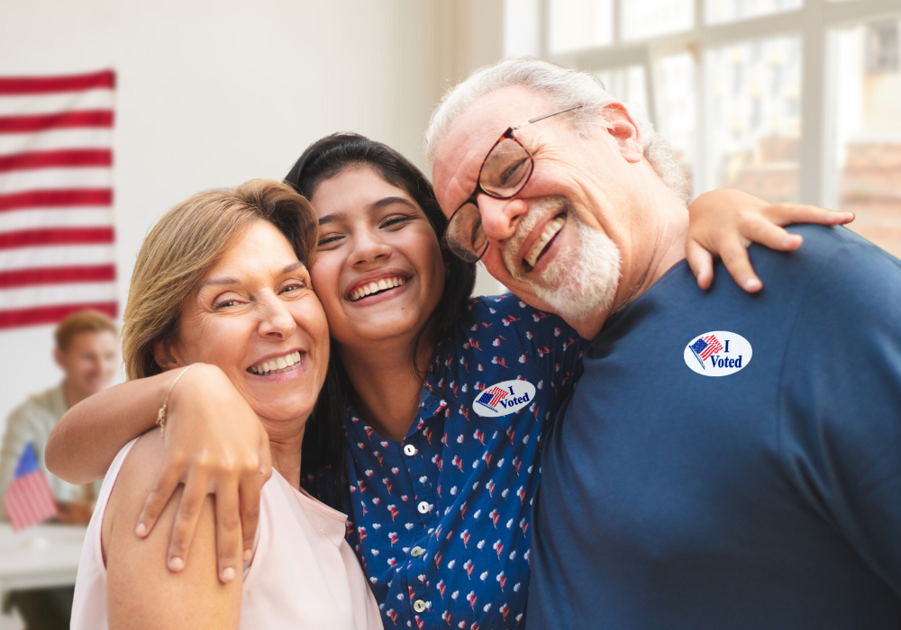 Three smiling adults with I Voted stickers