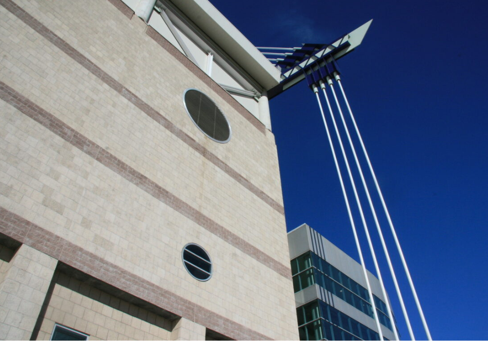 Close-up view of the Alamodome with a dark blue sky in background