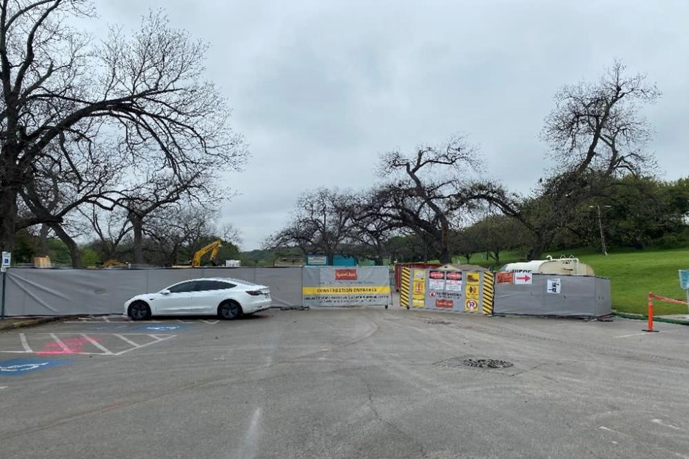 Image of Barton Springs Bath House parking lot and construction barriers