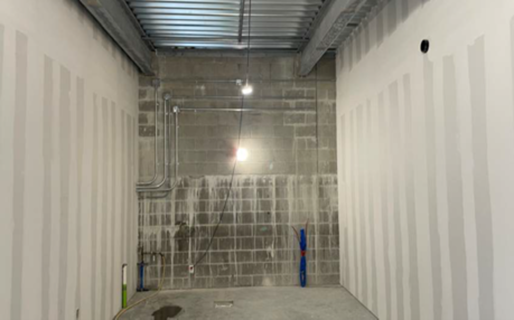 Central Utility Plant: Pump Room framed, taped, and floated drywall installed.