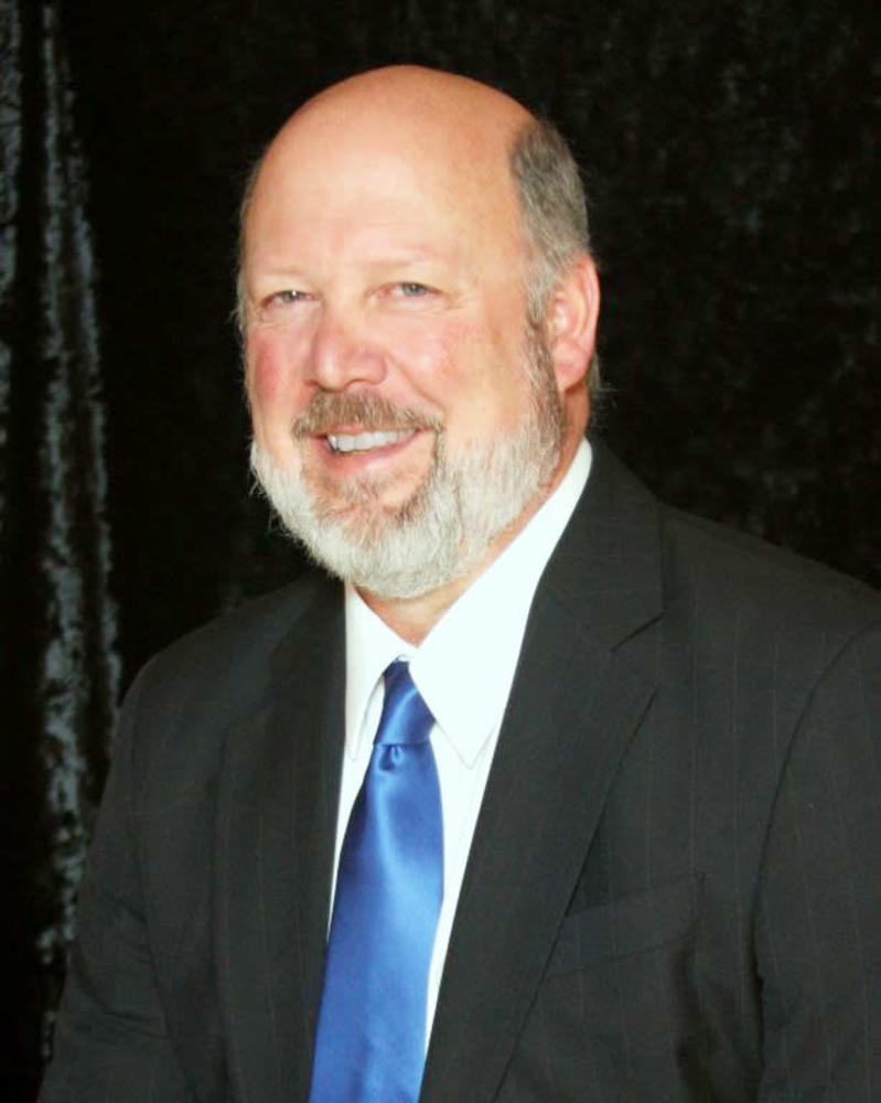 A man wearing a suit and tie