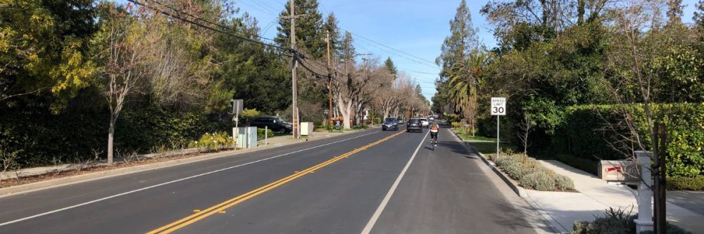 vehicle traffic and bicycle on Middle Avenue