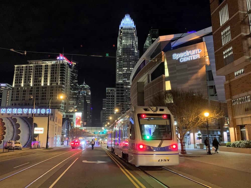 A new streetcar vehicles travels past the Charlotte Transportation Center during testing of the Gold Line
