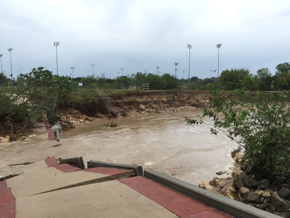 Image of the original pedestrian bridge at Roy G. Guerrero Park, which was destroyed by floodwaters in 2015.