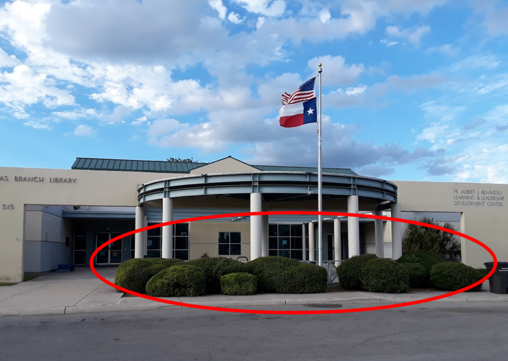 This photo shows the front of the Las Palmas Library building. A red circle indicates the public art project site location at 515 Castroville Rd, San Antonio, Texas 78237. 