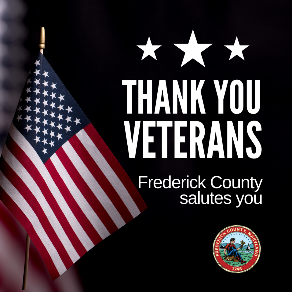 A flag and text that reads "Thank You Veterans. Frederick County Salutes You."