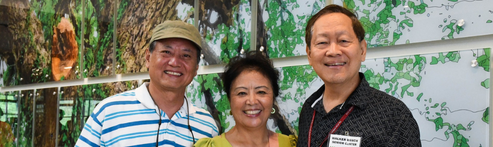 Three smiling older adults