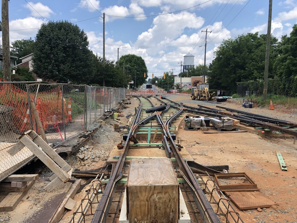 Workers install special trackwork on French Street