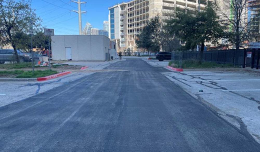 Parking Lot: View of asphalt patching and striping by Austin Energy after chilled water  lines were installed.