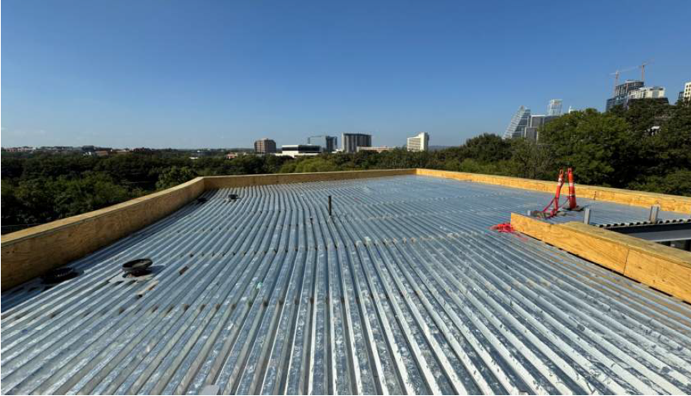 North Building Addition: Metal roof decking and parapet blocking.